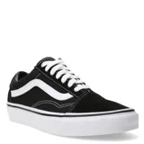 Championes Vans modelo Old Skool, color negro con la icónica banda lateral blanca. Confeccionados en una combinación de lona y gamuza, cuentan con suela de goma con diseño waffle, punteras reforzadas y cuello acolchado.