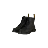 Botas Dr. Martens modelo 1460 Sub Lined, color negro, de caña media con cordones, suela chunky acanalada y tirador trasero característico con inscripción amarilla.