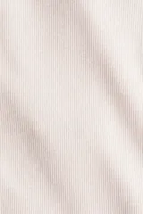 Top strapless de punto acanalado, color beige claro, con forro parcial.