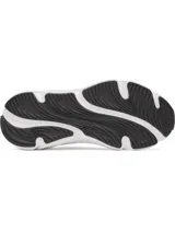 Zapatillas deportivas Under Armour modelo Rogue 6 para mujer, color negro con entresuela blanca gruesa y logo de la marca en el lateral. Presentan capellada de malla transpirable y cordones negros.