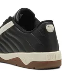 Championes urbanos Puma modelo Tifosi Calcio, color negro con la icónica franja lateral en blanco y suela de goma color caramelo. Diseño inspirado en el fútbol clásico con capellada de cuero sintético.