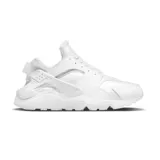 Championes Nike Air Huarache blancos, con ajuste tipo botín, clip icónico en el talón y suela de goma.