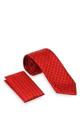 Corbata verde oscuro con estampado floral y pañuelo de bolsillo a juego.