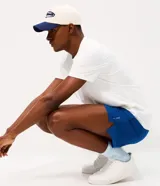 Bermuda deportiva Get Over de corte corto y ajuste suelto, confeccionada en tejido técnico de poliéster y elastano. Cuenta con cintura elástica y recortes con tecnología láser para mayor ventilación.