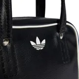 Bolso Adidas Adicolor XS de cuero sintético negro con ribetes blancos, logo frontal y correa de hombro ajustable y extraíble.