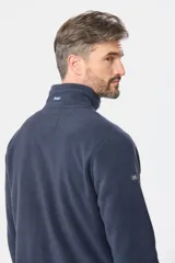 Campera polar de abrigo azul marino, con cuello alto, cierre frontal y bolsillos laterales y en el pecho con cierre.