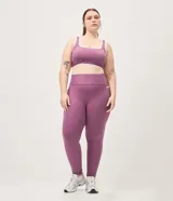 Pantalón deportivo legging de microfibra color violeta, con cintura alta elástica y bolsillos laterales.