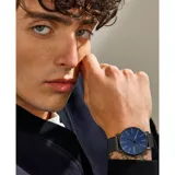 Reloj Skagen Signatur con caja de acero inoxidable negra de 40mm, esfera azul y malla metálica negra. Incluye una correa de cuero marrón intercambiable.