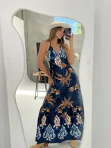 Vestido largo de algodón italiano con estampado floral, escote en V, espalda descubierta con elástico y tiras para atar al cuello.