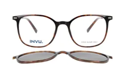 Anteojos de receta con armazón de acetato en estampado carey, que incluye un clip-on solar magnético desmontable con lentes oscuros.