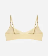 Top de bikini bandeau color amarillo claro, confeccionado en microfibra texturada con tirantes finos regulables adornados con cuentas y caracolas.
