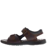 Sandalias de cuero marrón con diseño ergonómico, ajuste mediante tiras con velcro y suela de goma antideslizante.