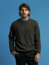 Sweater de tejido moteado con escote redondo y manga larga, con puños y ruedo acanalados.