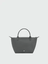 Cartera de mano Longchamp modelo Le Pliage One talla S, color amarillo, con solapa de cuero y cierre de botón a presión, asas cortas de mano y cierre superior con cremallera.