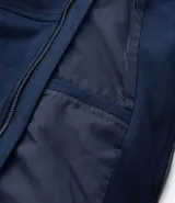 Chaqueta bomber de Marfinno en color tostado, con cierre frontal y cuello de tejido acanalado. Presenta un diseño liso con costuras horizontales y bolsillos funcionales.