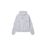 Hoodie de corte oversized en color gris melange, con capucha, bolsillo frontal tipo canguro y estampado gráfico en verde en el pecho y las mangas.