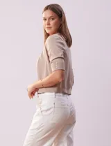 Bolero tejido color fucsia, marca Ninety, de manga corta con apliques de botones.