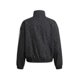 Campera deportiva Adidas Originals modelo Firebird con cierre frontal completo, cuello alto y puños elásticos. Presenta un estampado integral de patrón orgánico en tonos oscuros, con las icónicas tres tiras blancas en los hombros y mangas, y el logo del trifolio bordado en el pecho.