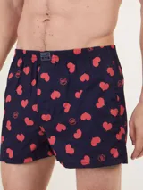 Bóxer de algodón blanco con estampado de flores pequeñas color celeste, con cintura elástica y logo de la marca en el centro.