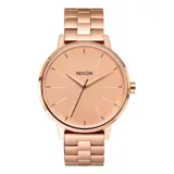 Reloj Nixon modelo clásico con caja y correa de acero en tono oro rosa, esfera minimalista a tono con índices marcados y segundero en contraste.