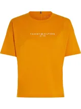 Remera deportiva Tommy Hilfiger de corte amplio y color naranja, con cuello redondo, hombros ligeramente caídos y logo de la marca estampado en el pecho.