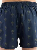 Bóxer de algodón blanco con estampado de flores pequeñas color celeste, con cintura elástica y logo de la marca en el centro.