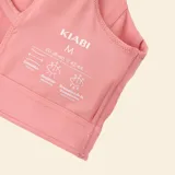 Sujetador deportivo de sujeción media color rosa, con diseño de escote redondo y espalda cruzada.