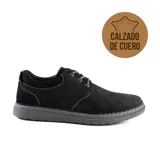 Zapato casual de cuero color negro con cordones grises y suela gris.