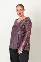 Blusa de fiesta con lentejuelas plateadas y verde esmeralda, forrada en viscosa, con escote en V y mangas tres cuartos.