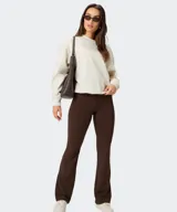 Buzo de felpa Fabletics de color beige melange, con cuello redondo y mangas largas, de diseño holgado y cómodo.