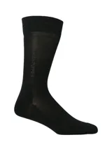 Medias de caña media Hush Puppies color negro, con logo de la marca tejido verticalmente en el lateral.