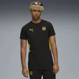Remera deportiva Puma del Club Atlético Peñarol, color negro con detalles en amarillo en los laterales y mangas. Presenta el logo de la marca y el escudo del club en el pecho.