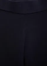 Pantalón wideleg de punto fino y tiro medio, en color negro, con cintura elástica sin cierre y diseño largo.