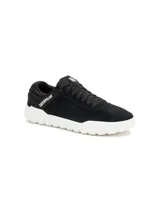 Sneakers Caterpillar modelo Hex +, de color negro con suela gruesa blanca y detalles de la marca en contraste.