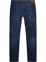 Jeans de corte recto confeccionados en tejido denim de algodón elástico azul oscuro. Presenta el parche con el logo de Tommy Hilfiger en la parte trasera.