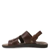 Sandalias de cuero vacuno color marrón habana, con diseño de tiras anchas cruzadas y ajuste mediante velcro en el talón. Presenta detalle de marca grabado en una etiqueta de cuero y suela de goma ergonómica.