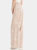 Pantalón palazzo de tiro alto, color beige con estampado de cachemir en blanco.