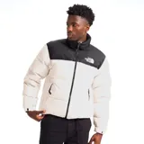 Campera puffer The North Face modelo 1996 Retro Nuptse 700, de diseño bicolor en blanco y negro, con cuello alto, cierre frontal y bolsillos con cierre.