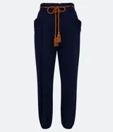 Pantalón harem azul marino de viscosa con cintura elástica, cordón ajustable, bolsillos laterales y puños elásticos.