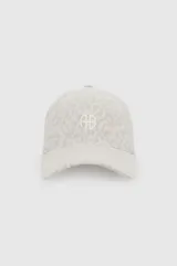 Gorra con visera curva de algodón, con estampado animal print en tonos beige y blanco, y monograma bordado en el frente.