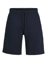 Short jogger de tejido de sudadera color azul marino, con fit relajado, cintura elástica con cordón ajustable y detalle de logo impreso en el lateral.