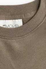 Buzo de tejido de algodón de peso medio, color marrón topo, con cuello redondo y hombros caídos. Presenta puños y bajo en punto acanalado.