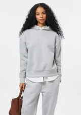 Sudadera con capucha de felpa, de corte holgado y diseño minimalista, con puños y ruedo acanalados.
