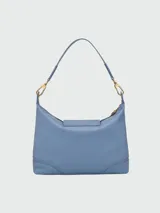 Cartera de hombro Longchamp modelo Le Pliage Xtra L, confeccionada en cuero de alta calidad en color azul. Presenta una solapa frontal con cierre de botón a presión metálico y una correa de hombro con detalles de cadena dorada.