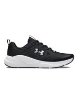 Championes deportivos Under Armour modelo Charged Commit TR 4, color negro con entresuela blanca y logo de la marca en el lateral.