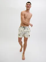 Short de baño de tiro medio con estampado botánico abstracto en tonos blanco, negro y amarillo sobre base color crema. Cuenta con cintura elástica con cordón ajustable, bolsillos laterales y bolsillo trasero.