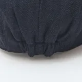 Gorra tipo gavroche de color azul marino con textura de espiga.