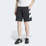 Short Adidas Adicolor Double Blocked de color negro, confeccionado en tejido ripstop. Presenta un diseño holgado, bolsillos laterales, cierre de cremallera, el logo del Trifolio bordado y detalles gráficos de franjas blancas en el lateral.