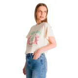 Remera color crema de corte holgado con estampado frontal de la marca Caterpillar en verde y rosa.