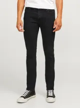 Pantalón jean negro de corte slim fit y tiro medio, con diseño clásico de cinco bolsillos y cierre de cremallera. Confeccionado en tejido de sarga con mezcla de algodón, poliéster, lyocell, viscosa y elastano.
